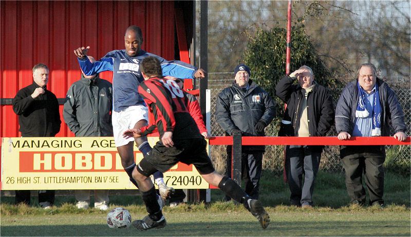 Tom Manton (10) tries to beat Wayne Clarke
