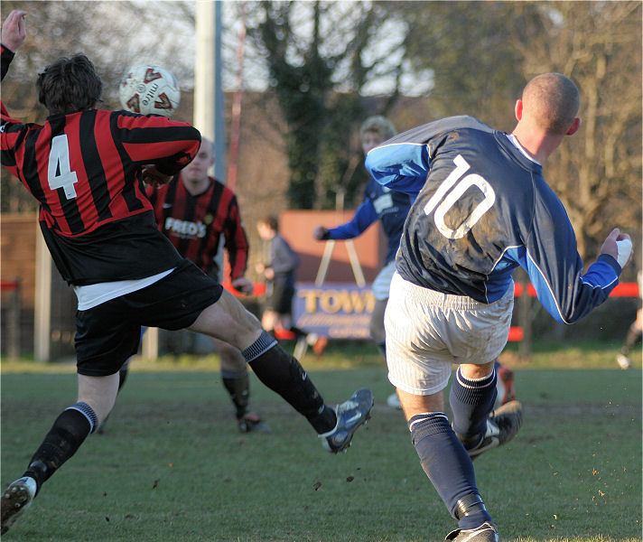 James Body gets a shot in as Kieron Howard tries to block
