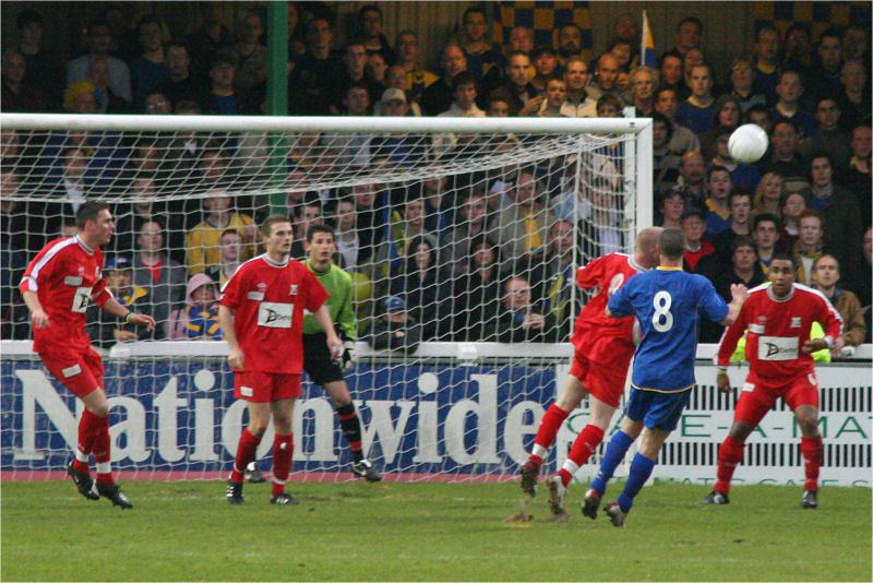 Sam Keevil (8) clears from Don's Michael Woolner (8) 
