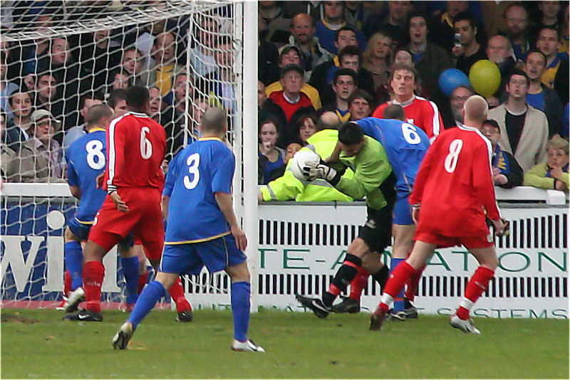 Nick Gindre grabs the ball pressured by Mark Cooper (6)
