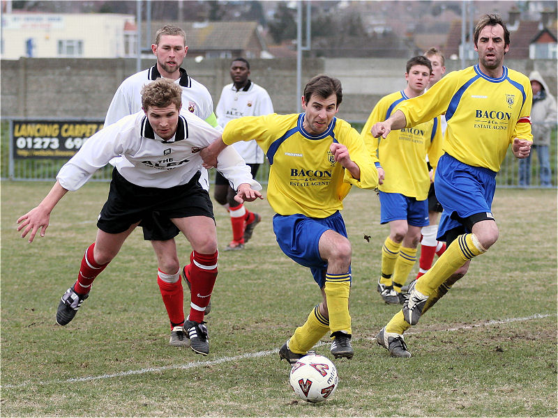 Christian Troak races into the area with Jordan Willis and Mark Burt on either side
