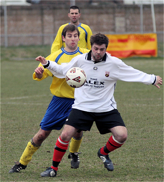 Rob Wimble brings the ball down under pressure ...

