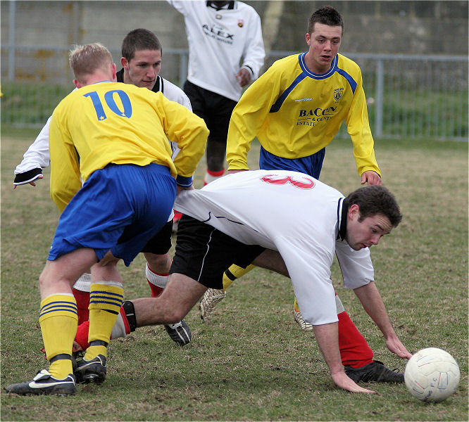 Mark Livermore gets past Rob Partridge
