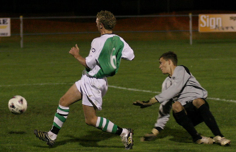 Callum Britton rounds the keeper but the ball goes just wide
