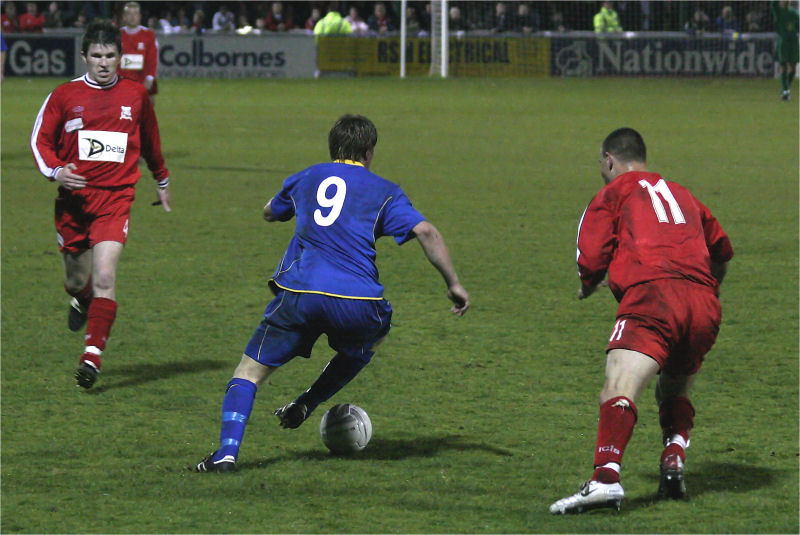 Richard Butler (9) goes past Simon Sibohy (11) with Francis Dolan (4) coming in
