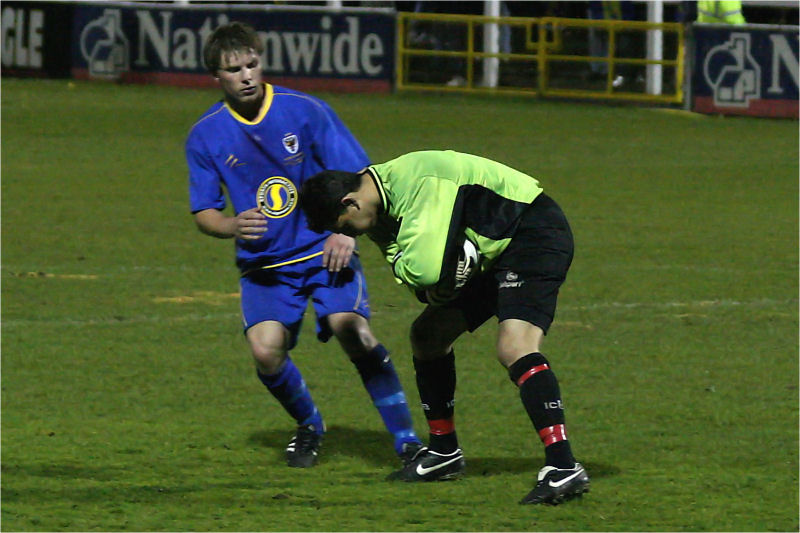 Nick Gindre protects the ball from Richard Butler
