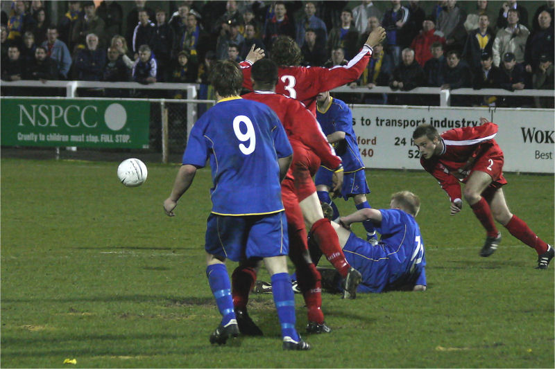 This scramble for the ball includes Richard Butler (9), Adam Thompson (part hidden), Sean Thurgood (3), Lee Riddell (2), and Steve Butler (12)
