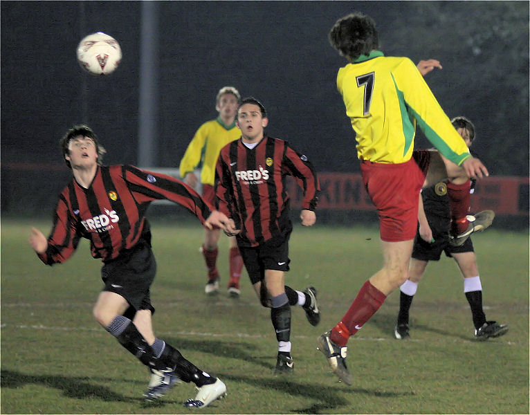 Graeme Beveridge heads from Kieron Howard and Marc Cooper 
