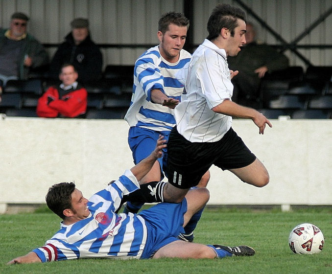 James Rhodes is tackled by Justin Cole
