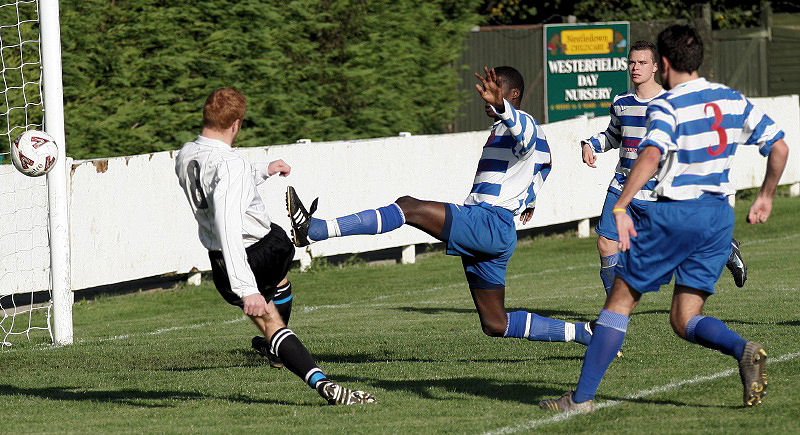 Leo Day beats a tackle from Richard Ogoe ...
