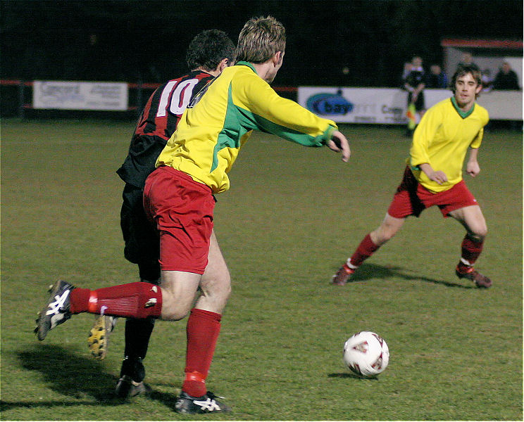 Tom Manton tries to get past Anthony Hibbert
