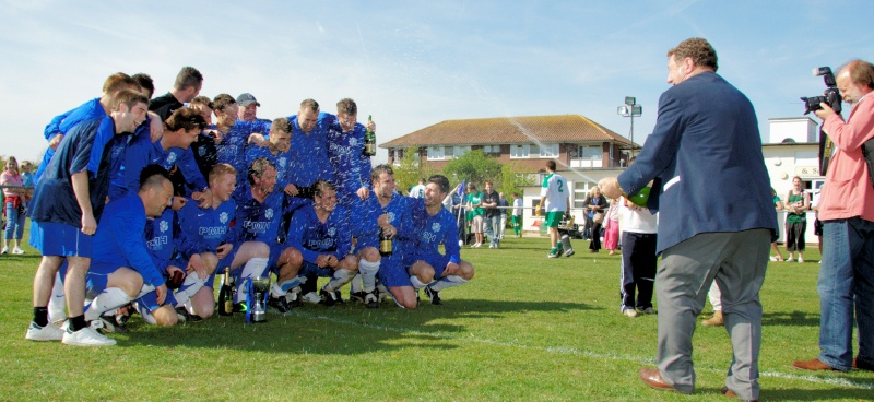 Chairman John Virgo gives the champions a soaking
