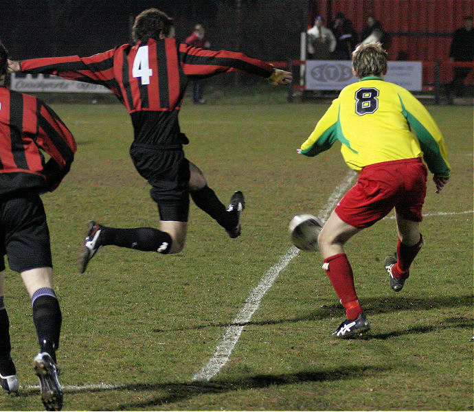 Chris Morrow (4) beats Anthony Hibbert (8) to the ball
