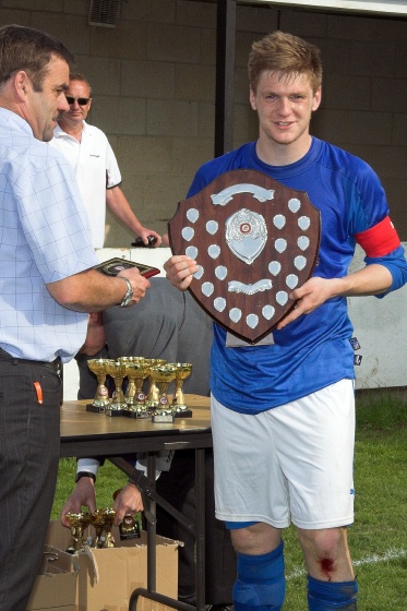 Aaron Meehan with the League Trophy
