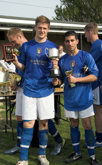 Captain Aaron Meehan shows off the cup
