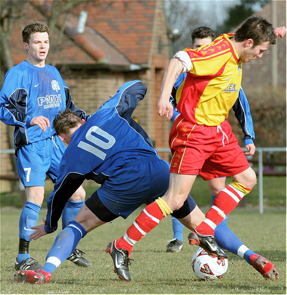 Craig Cox (10) tackles Kevin Marchesi
