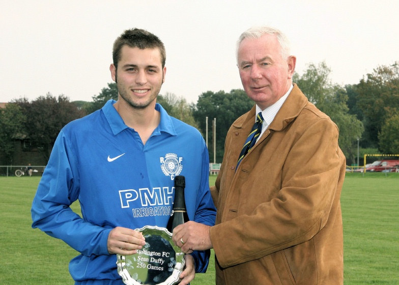 Peter Wells of Sussex County FA makes a presentation to Sean Duffy marking 250 appearances for Rustington
