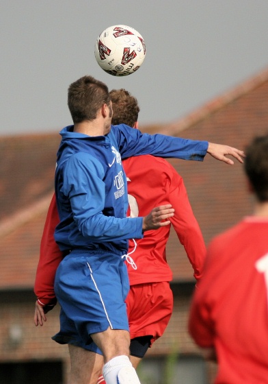 Sean Duffy and Eddie Bollingbroke go up for a header
