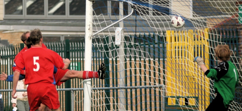 Ryan Walton gets between 2 defenders to head Rustington's first ...
