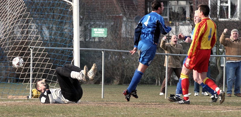 Terry Withers free kick from distance deceives keeper Mark Hildersley in the strong wind for Rustington's 2nd ...
