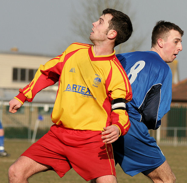 Gary Holmes and Adam Bibb look for the ball
