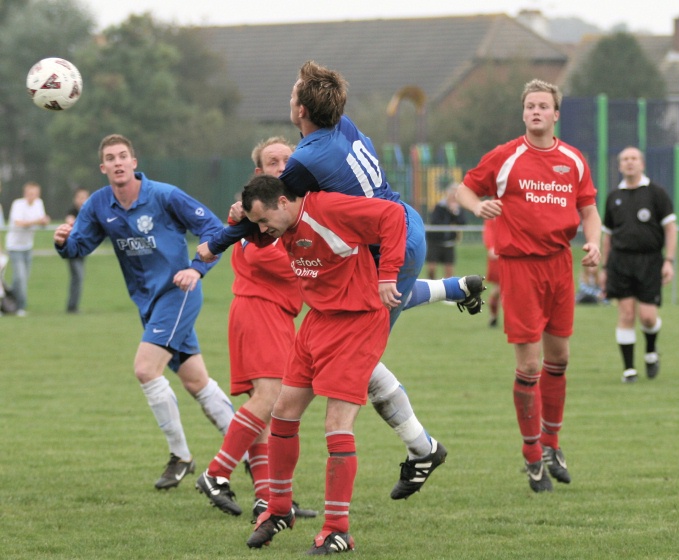 The ball brushes Ryan Walton's shoulder resulting in a free kick
