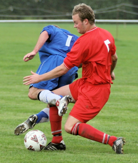 Richy Moss is tackled by Kieran Fielding
