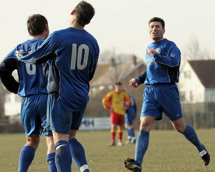 Dave Oakes is congratulated by Craig Cox and Terry Withers
