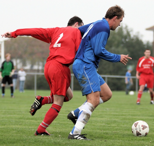 Ryan Walton shields the ball from Ben Laycock
