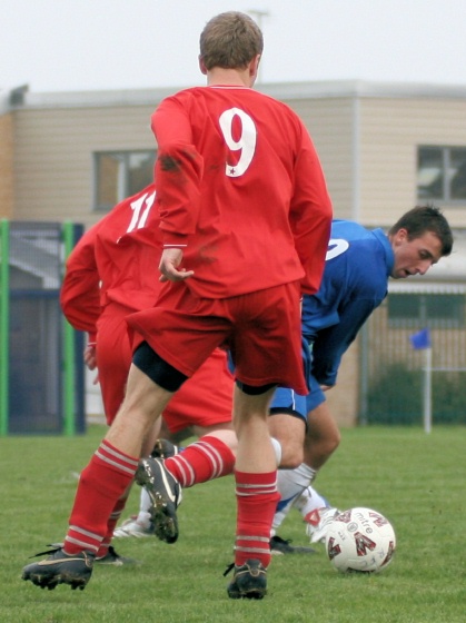 Adam Bibb goes between Robbie Hawkins and Andy Senior
