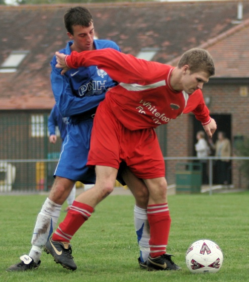 Robbie Hawkins shields the ball from Adam Bibb
