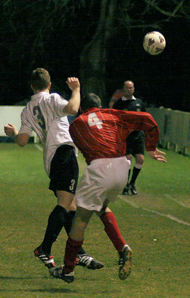 Dave McCarthy and Jim Smith compete for a header
