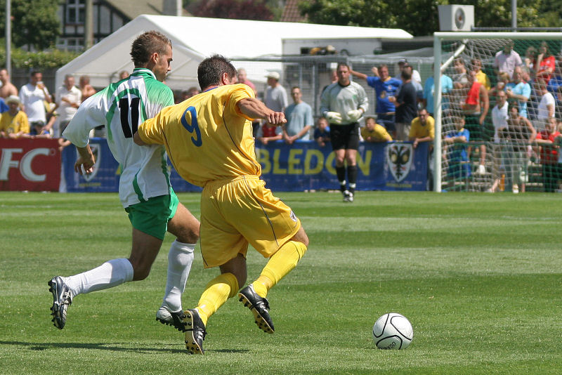 Daniel Beck and Ricci Crace go for the ball
