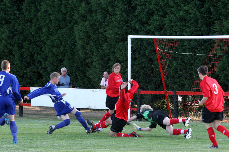 Wick keeper Tom Rand with help from Gavin Heater and Pete Christodoulou attempts to stop this first minute attack by James Highton
