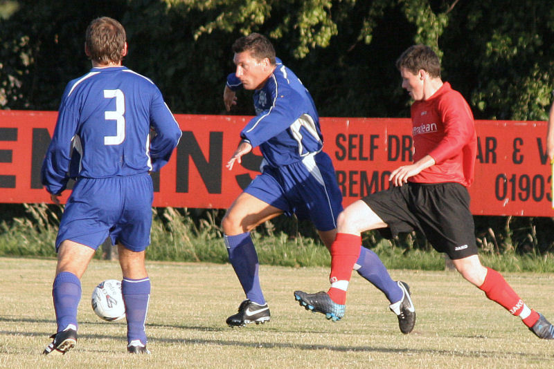 Wick's Kieron Howard tries to stop Terry Withers
