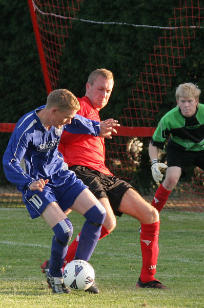 Wick's Paul Hodder challenges James Highton
