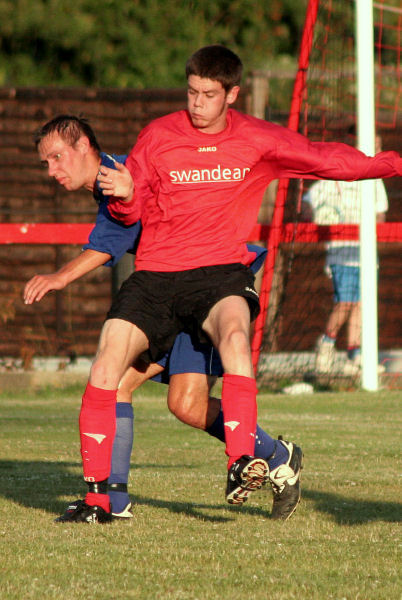 Dan Jarvis (Wick) tussles with Kevin Clayton 
