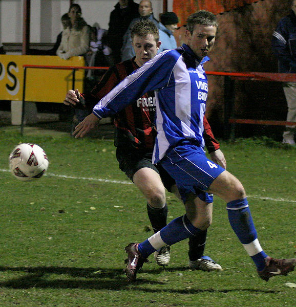 Danny Curd brings the ball back round Matt Kelly
