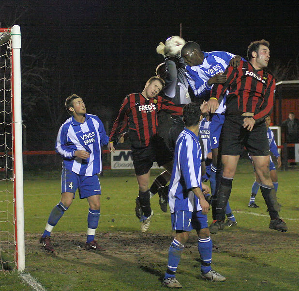 Alan Mansfield and Eddie Achoko beat Danny Curd and Pete Christodoulou to a corner
