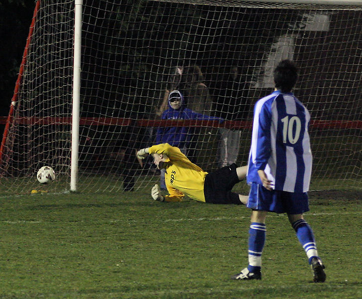 ... and Tom Rand pushes the ball round the post
