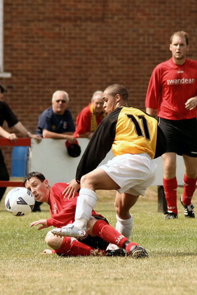 Dave Sharman tackles Loui Fazakerley watched by Dave Turner
