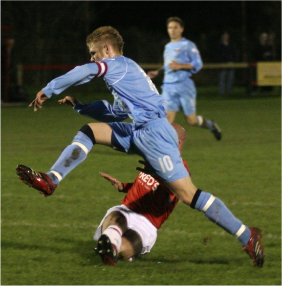 Lee Farrell jumps a Tony Miles tackle
