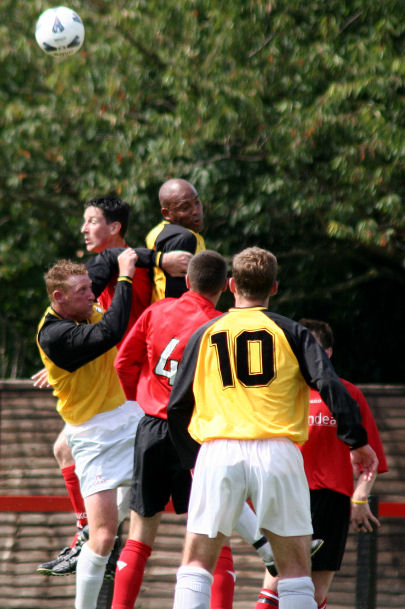 Dave Sharman and Stafford Browne go up for this header with Andy Atkin, Chris Morrow (4) and Scott McDonald (10) ?
