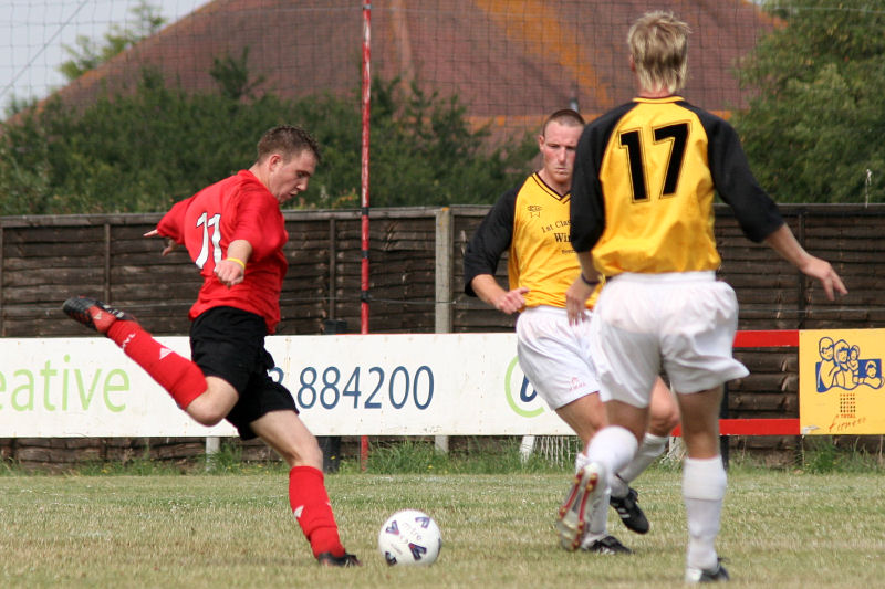 Danny Curd strikes between Stuart Tuck and Peter Featherstone
