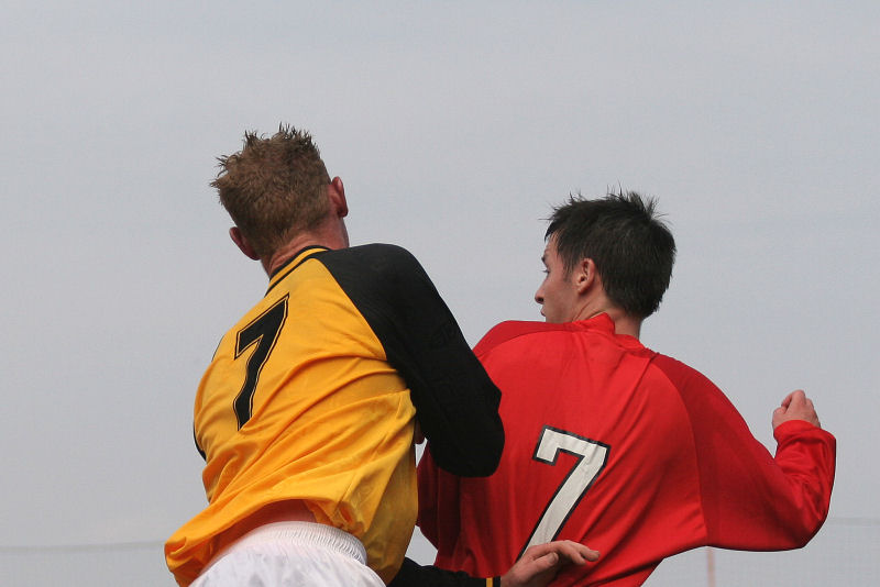 Andy Atkin and John Spragg go for a header
