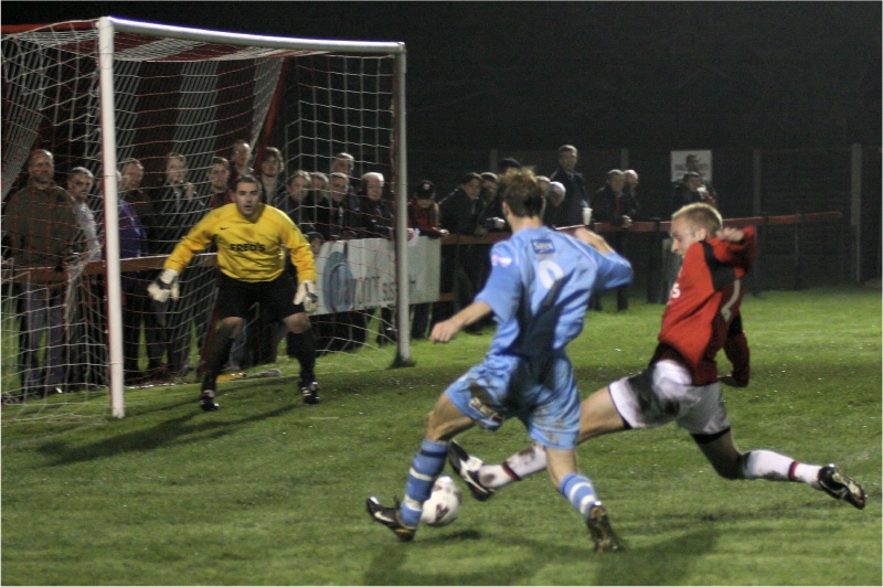 Dave Hall gets the ball away from Mark Goodwin
