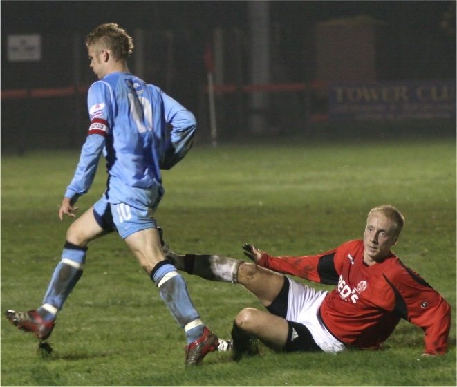 Dave Hall nicks the ball away from Lee Farrell
