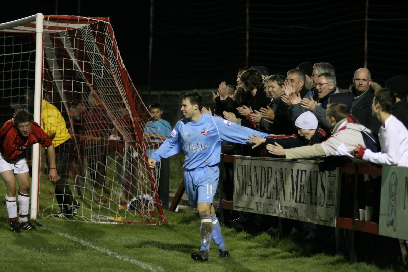 Jamie Cade's goal is celebrated with the fans ...
