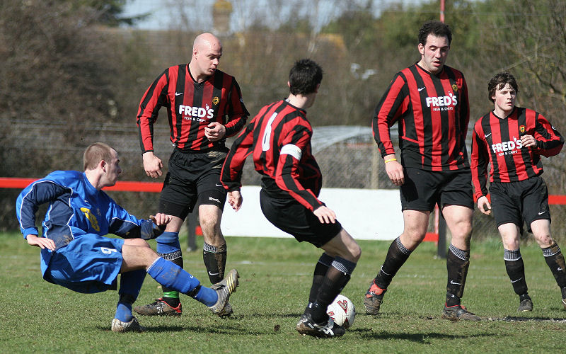 Josh Biggs fires through a group of Wick players
