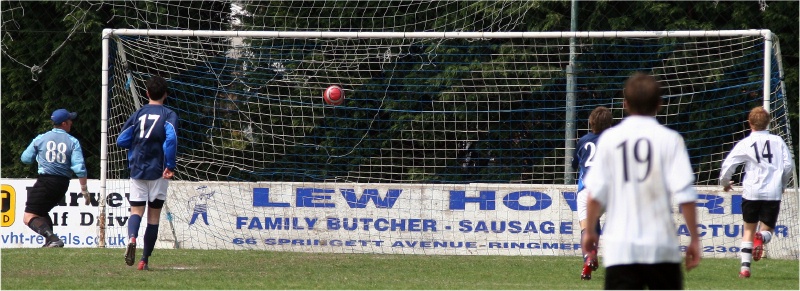 Ryan Walton (out of picture) gets his hat trick, shot from a narrow angle off the underside of the bar ...

